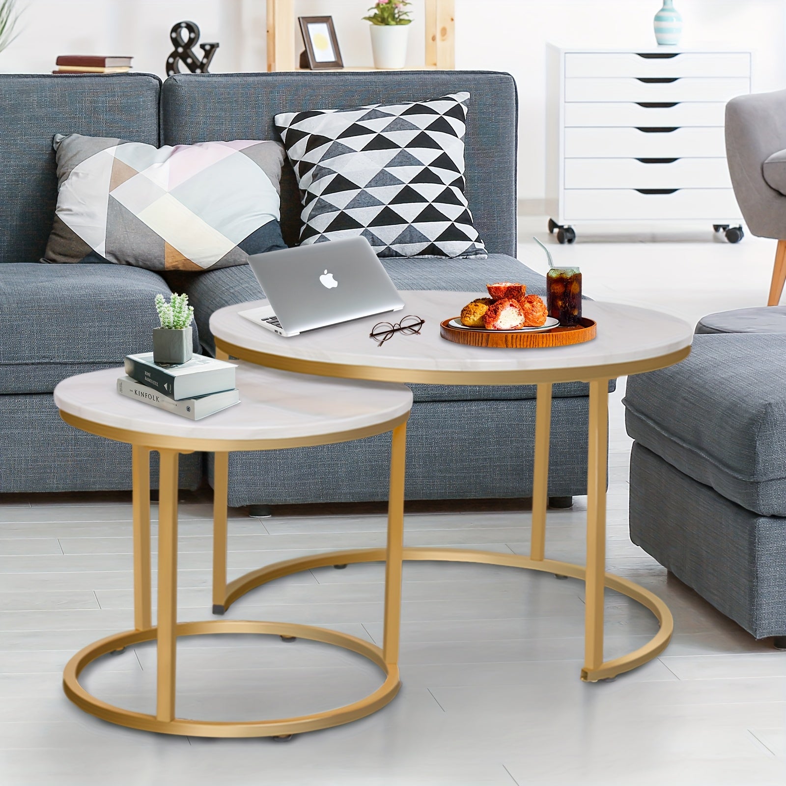 Set of Two Circular Nesting Tables Featuring a White Faux Marble Top And a Golden Frame, Perfect for Modern Living Rooms Or Bedrooms with an Industrial Touch